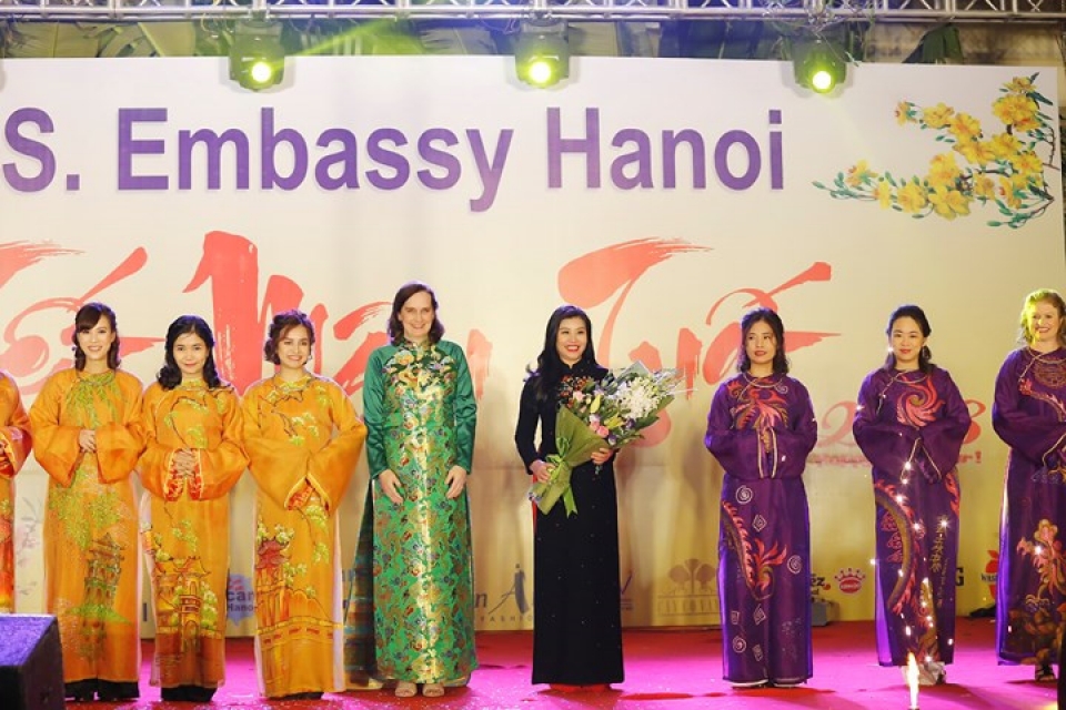 us ambassador his family wear red ao dai to embassy tet event