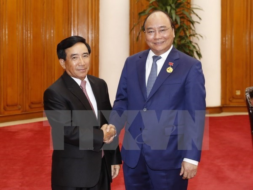 pm nguyen xuan phuc pledges continuous support for laoss nation building