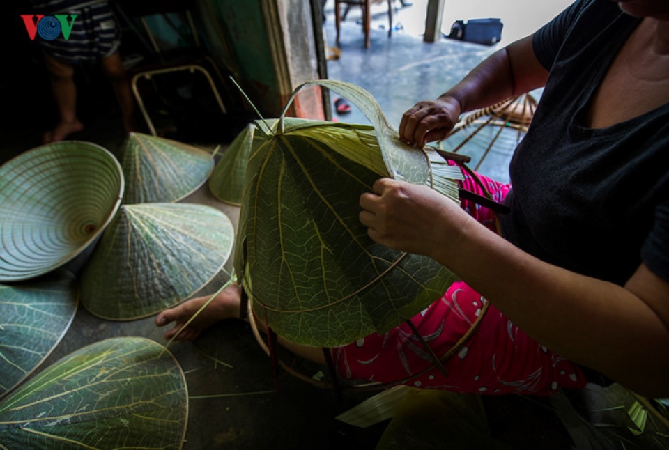 lotus leaf conical hat making at craft villages in hue