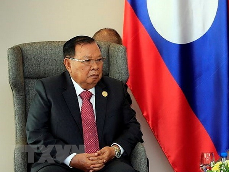 top lao leader receives vietnamese party officials