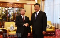 party state officials offer incense at thang long royal citadel