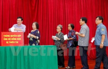 Overseas Vietnamese in Laos help disaster victims