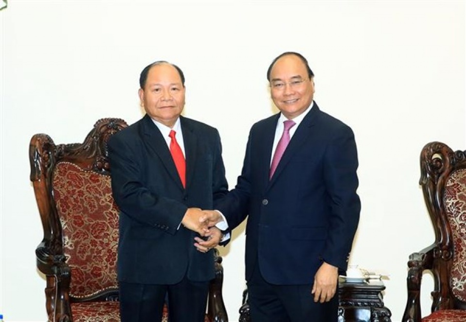 pm lauds vietnam laos cooperation in home affairs