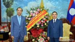 Thứ trưởng Ngoại giao Nguyễn Quốc Dũng chúc Tết cổ truyền Bunpimay Nhân dân các dân tộc Lào
